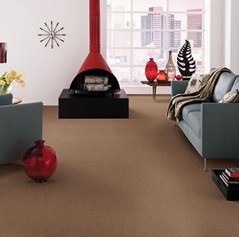 Living room scene with brown American Showcase carpet.
